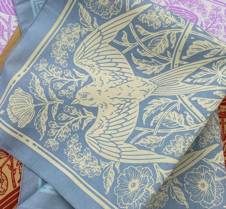The For Keeps Barn Swallow handkerchief, block printed with a bird in flight and blue and ivory tones