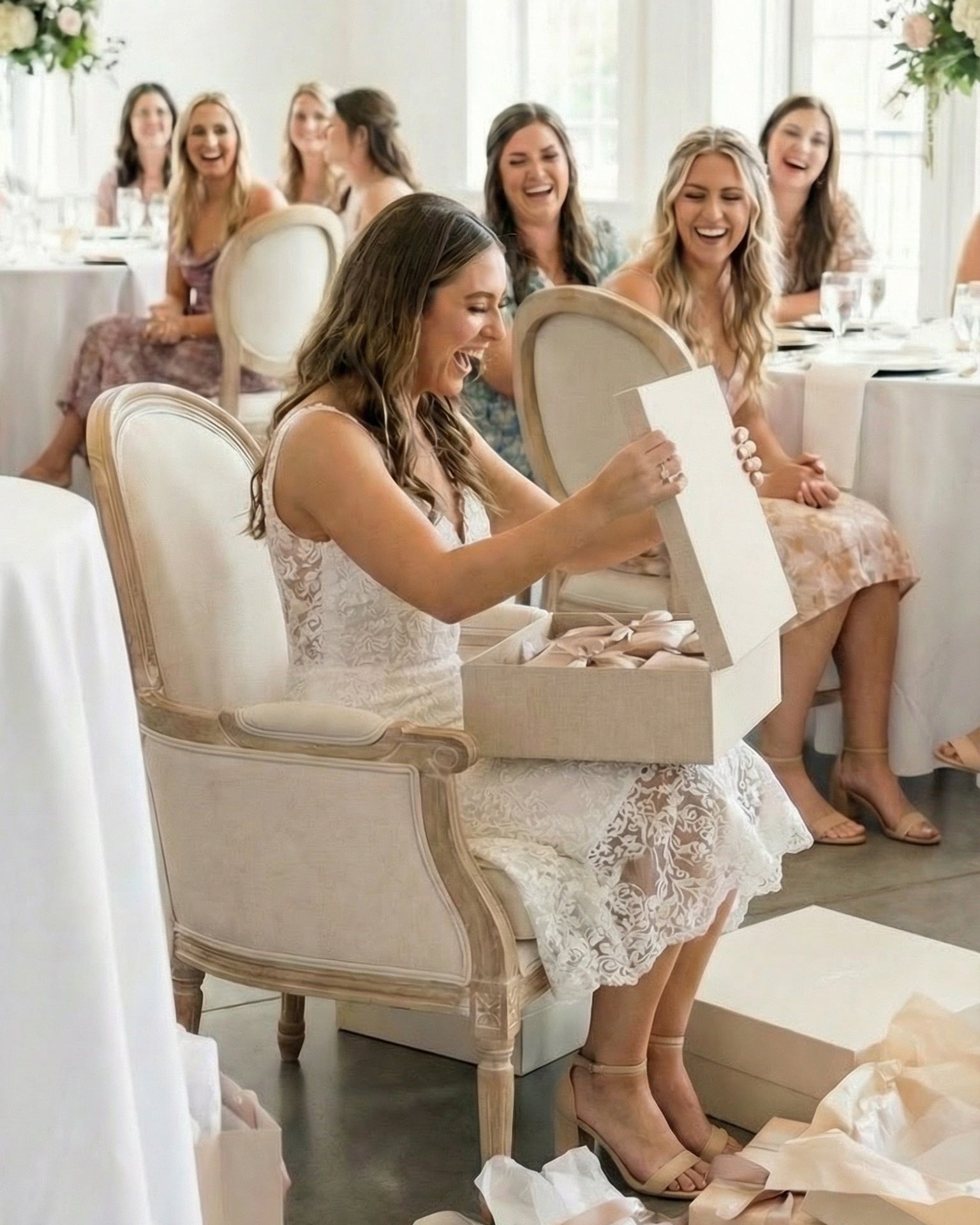 Woman opening an EVR Heirloom Box at her bridal shower by for keeps