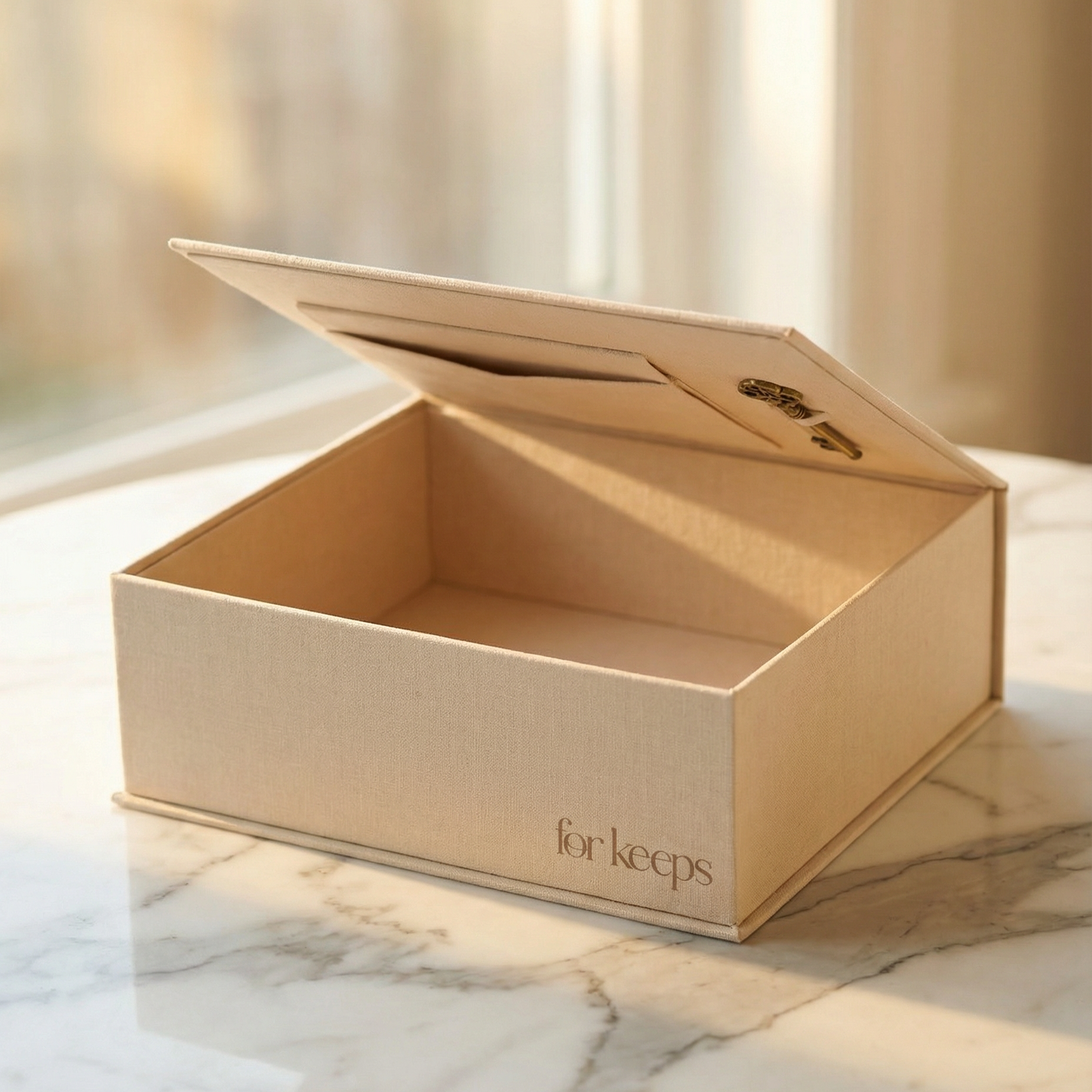 The EVR Heirloom keepsake box. Linen covered with a space for notes and a skeleton key bottle opener