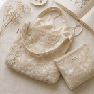 Ivory embroidered bridal tote and pouch with a satin slip and baby's breath